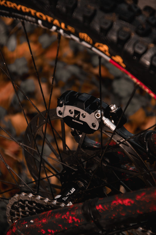 Close-up of SRAM Maven 4-piston brake caliper with Gorilla Brakes pads installed on MTB